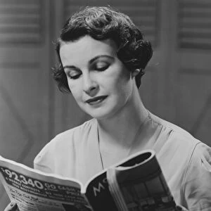 Woman reading magazine (B&W)