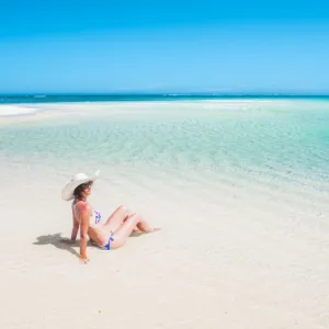 Woman relaxing on the beach. Turquoise Bay, Western Australia