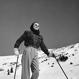 Woman skier standing on slopes