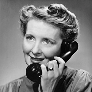 Woman talking on telephone
