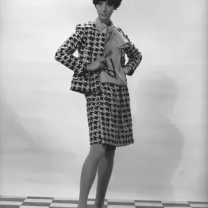 Woman wearing costume posing in studio, (B&W), portrait Woman wearing costume posing in studio, (B&W), portrait