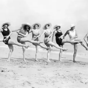 Women Kicking in Unison on the Beach Women Kicking in Unison on the Beach