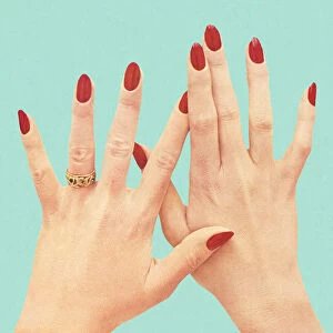 Womens Hands With Red Polish