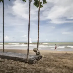 Woodern swing on the beach Woodern swing on the beach