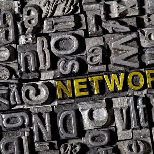 The word NETWORK among on the letterpress letters