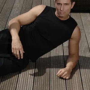 Young athletic man lying on a terrace