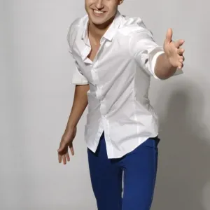 Young man in white shirt and blue jeans in movement
