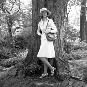 Young woman leaning by tree, (B&W) Young woman leaning by tree, (B&W)