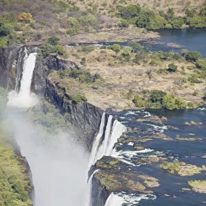 Zambezi River flowing over Victoria Falls, aerial view