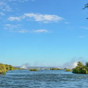 Zambezi River view with the spray from Victoria Falls in the distance. Livingstone. Zambia