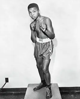 Prints of At 12-years old Cassius Clay (later Muhammad Ali) shows his best pugilist stance A photo tribute to the boxing legend: 12-Year-Old Cassius Clay