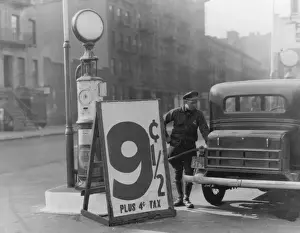 Prints of A New York chauffeur fills up his gas tank at 9 1/2 cents plus 4 cents tax, circa 1930. (Photo by FPG/Hulton Archive/Getty Images) Black and White Images Capturing the Essence of Mid-20th Century: Fill Her Up