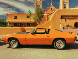 Prints of Vintage 1970's Orange Camaro on the street outside San Felipe Church in Old Town Albuquerque, New Mexico USA Travel Destination Prints: 1970's Bright Orange Camaro and Adobe Church in the Southwest, USA