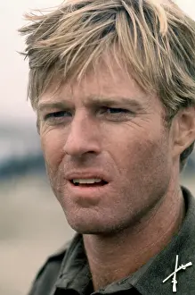 Prints of American actor Robert Redford, is Major Julian Cook, poses for a portrait on the set of the 1977 drama film A Bridge Too Far, in Nijmegen, Gelderland, Netherlands, circa 1977 Robert Redford: Classic Hollywood Elegance: 1977 Movie A Bridge Too Far