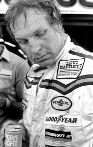 Prints of DAYTONA BEACH, FL - FEBRUARY 1983: NASCAR driver Joe Ruttman talks with reporters after competing in the 1983 Daytona 500 stock car race at Daytona International Speedway in Daytona Beach, Florida Full Throttle At Daytona Beach Prints: 1983 Daytona 500