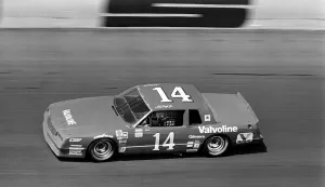 Prints of DAYTONA BEACH, FL - FEBRUARY 1983: NASCAR driver A.J. Foyt circles the track during the running of the 1983 Daytona 500 stock car race at Daytona International Speedway in Daytona Beach, Florida Full Throttle At Daytona Beach Prints: 1983 Daytona 500