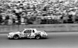 Prints of DAYTONA BEACH, FLORIDA - FEBRUARY 1984: NASCAR driver Dean Combs speeds past the grandstands during the running of the 1984 Daytona 500 NASCAR race at Daytona International Speedway in Daytona Beach Chasing Speed: Motorsport in Motion: 1984 Daytona 500