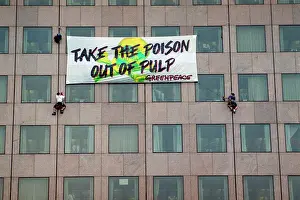 Environmental Issues Prints: 2 Climbers Hang Greenpeace Sign On Blg