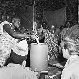 Ballot Prints: 2 Men (Trad. Dress) Cast Ballots In Box
