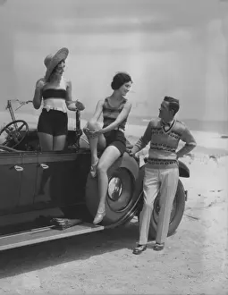 Pants Prints: 2 Women Bathing Suits Posed On Convertible Car With Man In Striped Trousers And Vest Looking On Upscale Fashion Wealth