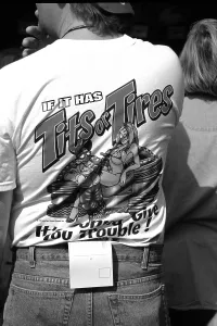 Prints of DAYTONA BEACH, FLORIDA - FEBRUARY 2003: A NASCAR race fan wears a risque novelty T-shirt at the 2003 Daytona 500 stock car race at Daytona International Speedway in Daytona Beach, Florida Chasing Speed: Motorsport in Motion: 2003 Daytona 500