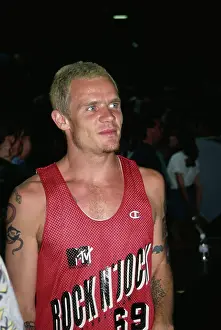 Prints of Australian-born American musician and actor Flea (born Michael Peter Balzary), wearing the red Rock N Jock singlet, at the 3rd Annual MTV Rock N Jock B-Ball Jam Courtside Vibes: Stunning Basketball Prints: 3rd Annual MTV Rock N Jock B-Ball Jam