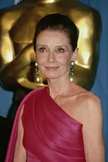 Prints of British actress Audrey Hepburn (1929-1993), wearing an asymmetrical fuchsia pink evening gown, in the press room of the 64th Academy Awards, held at the Dorothy Chandler Pavilion in Los Angeles Elegance Personified – A Classic Art Print Collection: 64th Academy Awards - Press Room