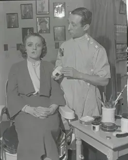 A. B. Shore Making up Woman