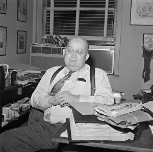 A. J. Liebling Sitting at Desk