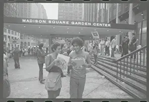 Abbie Hoffman Conversing with Young Lady