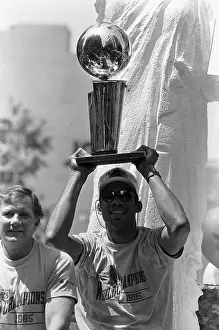 Abdul-Jabbar Holds up NBA Championship Trophy