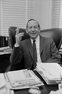 Abe Fortas Smoking a Cigar at His Desk