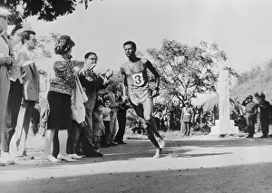 Marathon Prints: Abebe Bikilla Running in Marathon