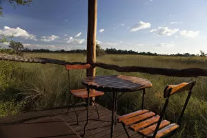 Botswana Gallery: absence, botswana, chair, color image, day, deck, empty, grass, horizontal, landscape