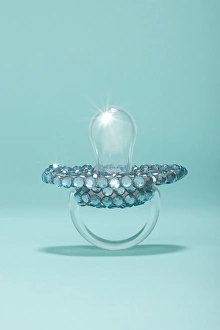 aby pacifier covered in diamonds on blue aby pacifier covered in diamonds on blue