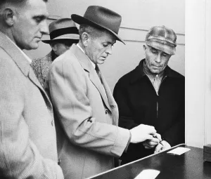 Printing Prints: Accused Murderer Ed Gein Being Fingerprinted by Police