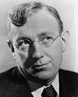 Actor Alec Guinness Smirking
