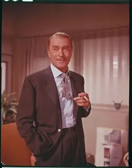 Actor Brian Aherne Holding Cigarette in Movie Scene
