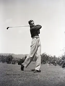 Actor Cesar Romero Playing Golf