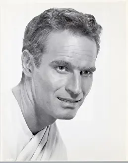 Actor Charlton Heston In A Toga