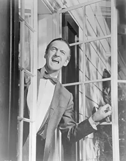 Actor David Niven Leaning out of Window