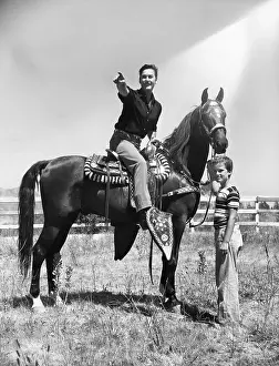 Fatherhood Prints: Actor Errol Flynn and Son While Horseback Riding