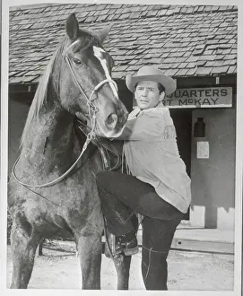 Actor Jack Kelly Mounting Horse