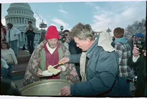 Actor Martin Sheen Serving Food to Mitch Snyder at Homeless Protest