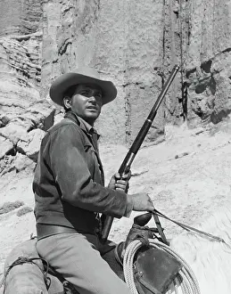 Actor Michael Landon of Bonanza Pausing on Horseback
