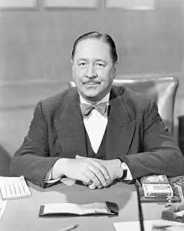 Full Face Prints: Actor Robert Benchley Seated Behind Desk