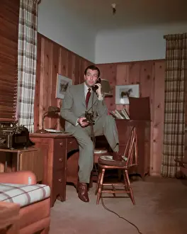 Actor Robert Taylor Talking on Telephone