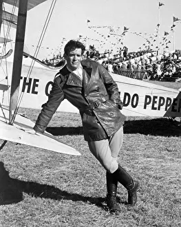Actor Scott Newman Leaning on Plane