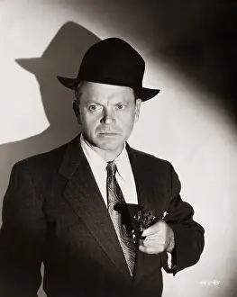 Actor Standing with Gun