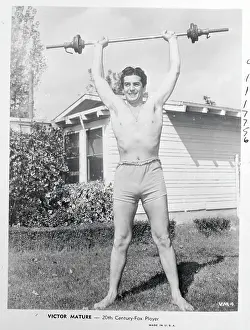 Actor Victor Mature Lifting Barbell